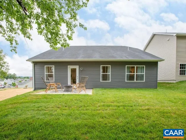 a front view of house with yard and seating area