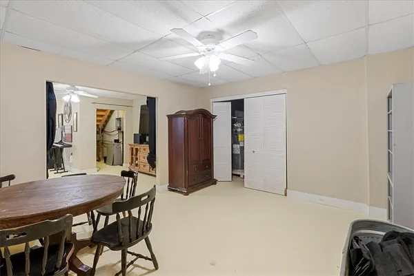 a view of a room with furniture and wooden floor