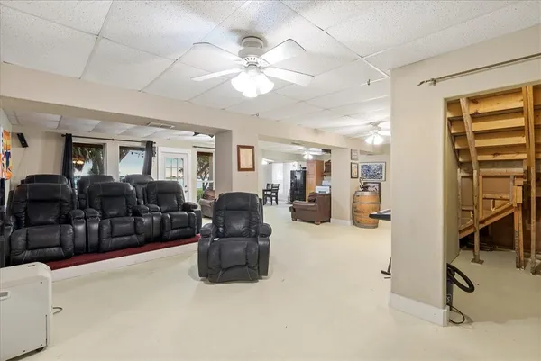 a living room with furniture a dining table and chairs