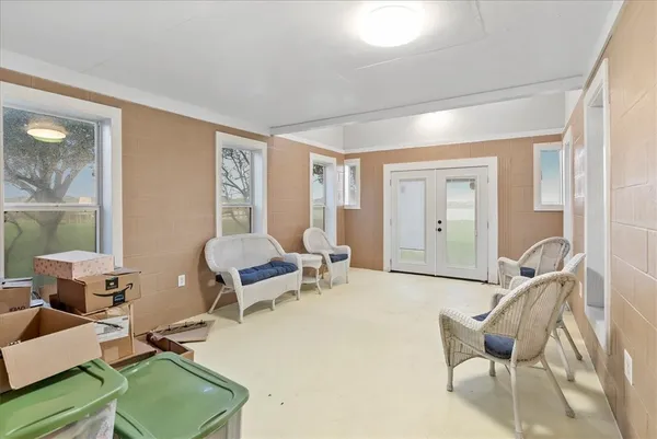 a living room with furniture and a window