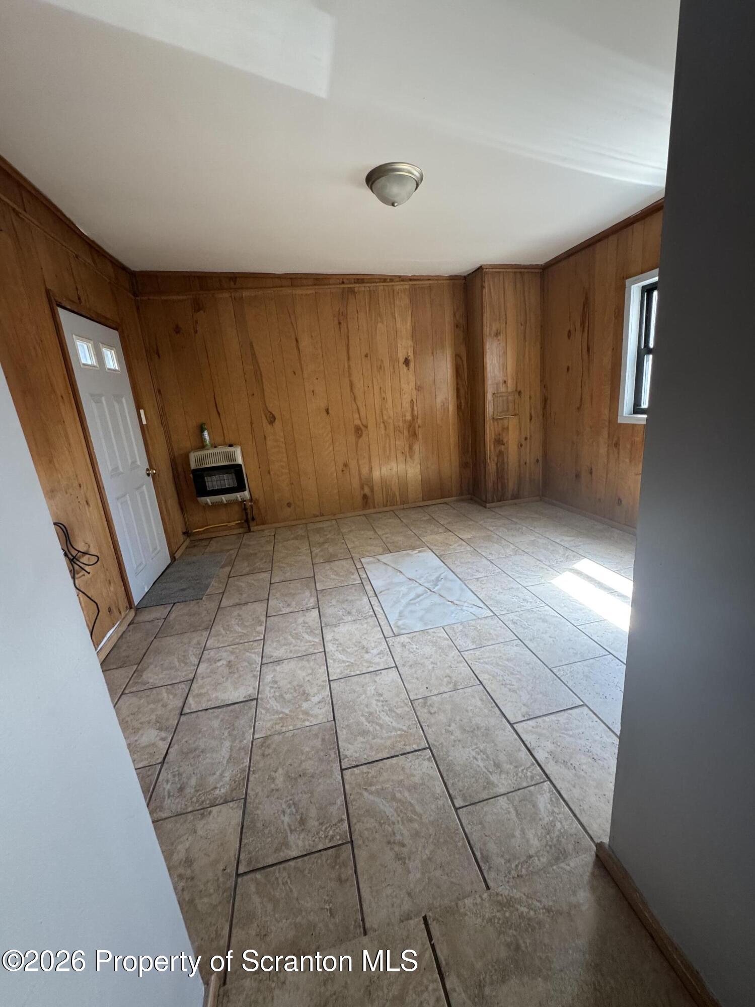 906 West Market Street Scranton, PA 18508 - Photo 5 of 10 a view of a livingroom with an empty space and a window
