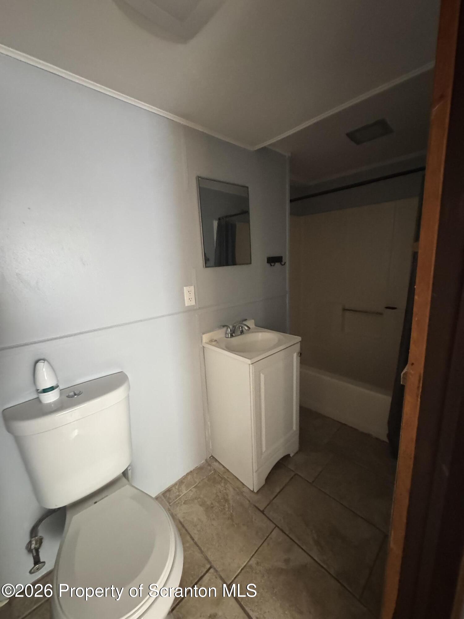 906 West Market Street Scranton, PA 18508 - Photo 9 of 10 a bathroom with a toilet and a sink