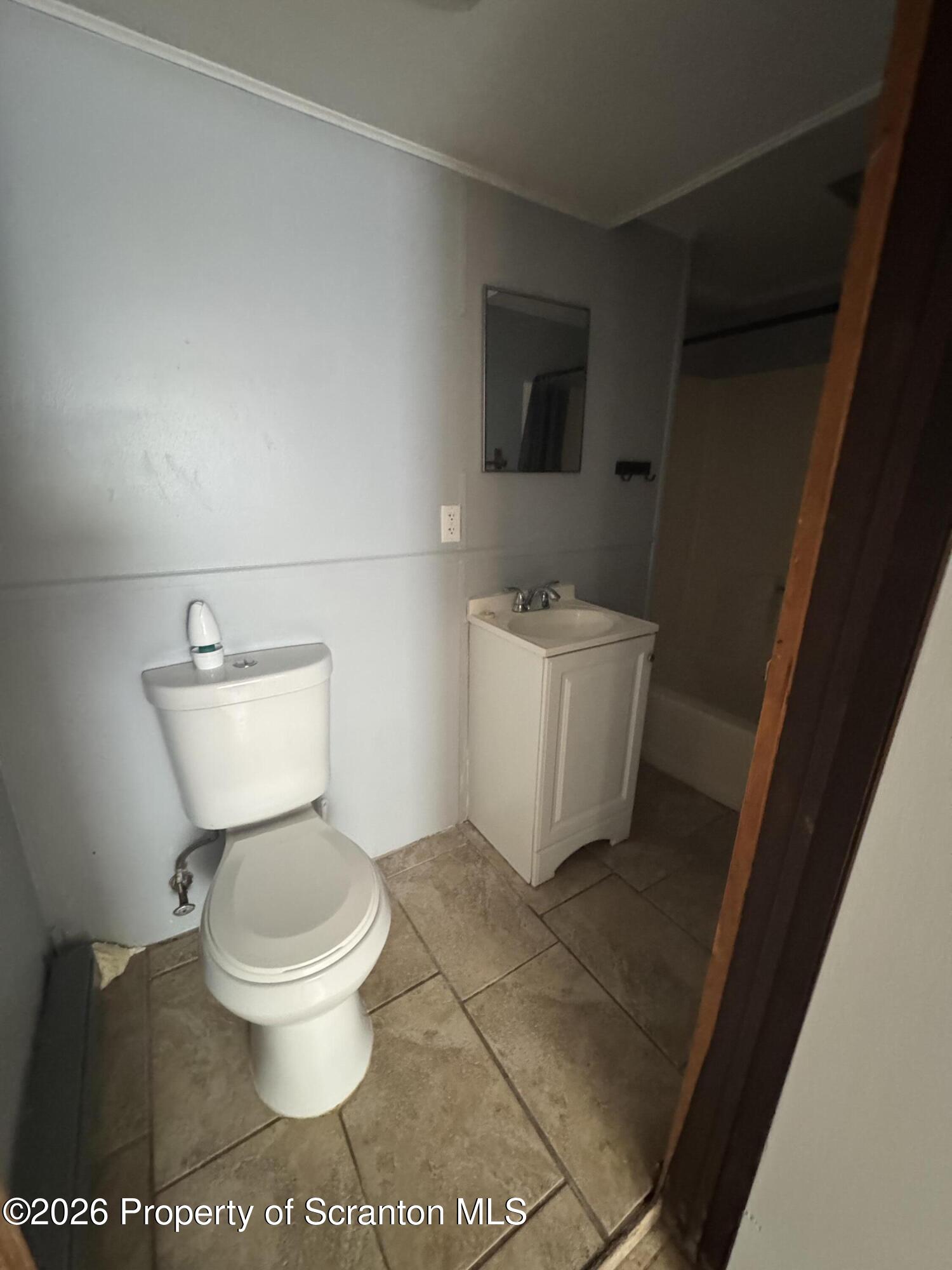 906 West Market Street Scranton, PA 18508 - Photo 10 of 10 a white toilet sitting next to a bathroom sink