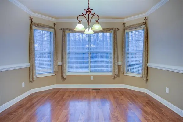 a view of a livingroom with furniture and a flat screen tv