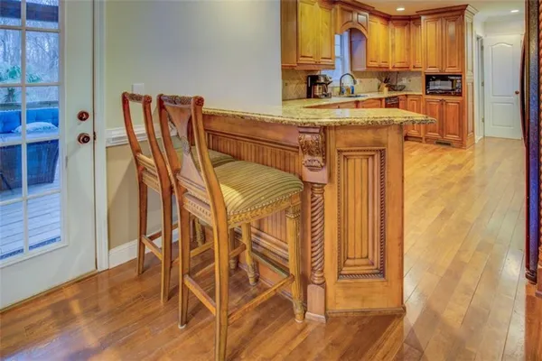 a kitchen with stainless steel appliances a sink and a refrigerator
