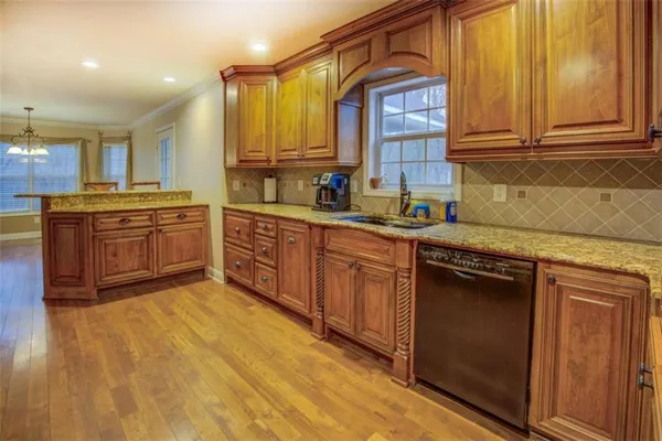 a kitchen with a stove microwave and cabinets