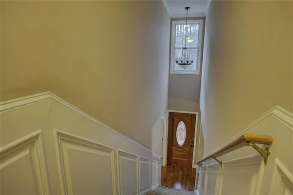 an empty room with a ceiling fan and window