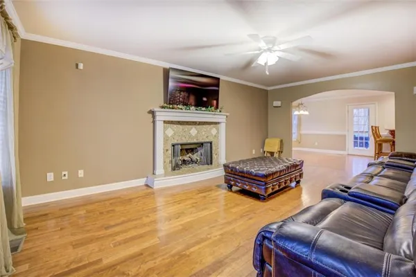 a living room with furniture and a fireplace