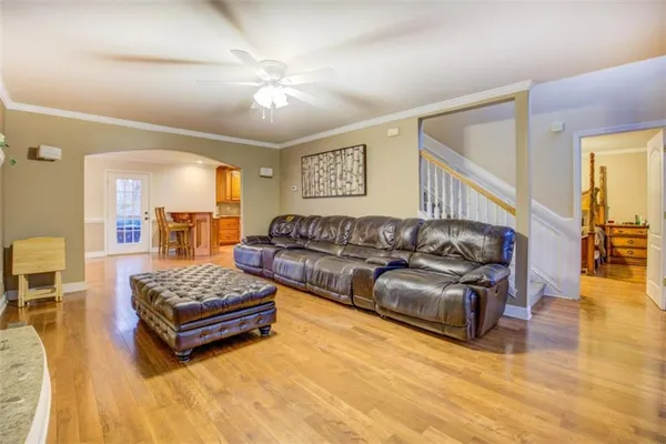 a spacious bedroom with a bed and couch