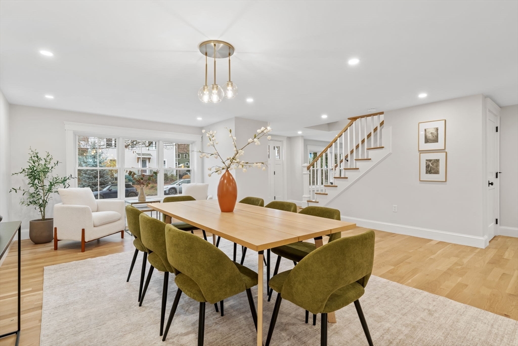 56 Valentine Road Arlington, MA 02476 - Photo 14 of 42 a view of a dining room with furniture and wooden floor