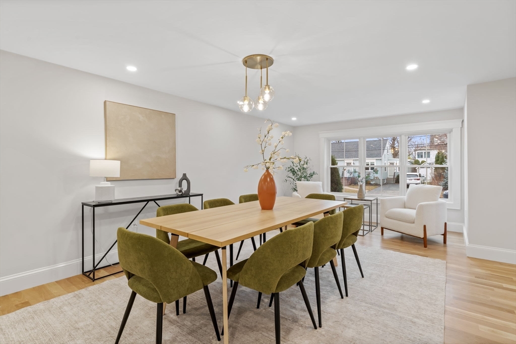 56 Valentine Road Arlington, MA 02476 - Photo 15 of 42 a view of a dining room with furniture and wooden floor