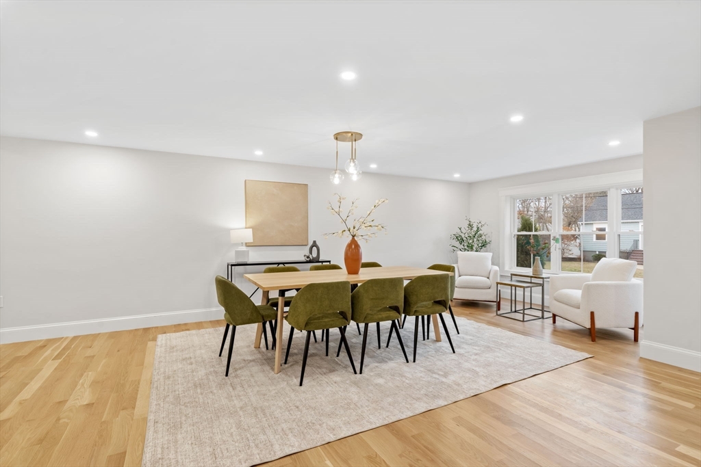56 Valentine Road Arlington, MA 02476 - Photo 17 of 42 a view of a dining room with furniture and wooden floor