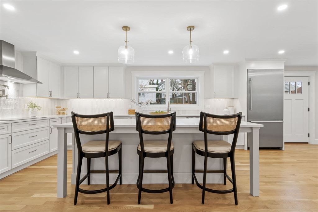 56 Valentine Road Arlington, MA 02476 - Photo 18 of 42 a view of a dining room with furniture and wooden floor