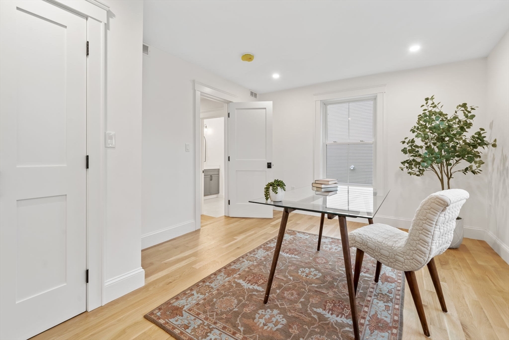 56 Valentine Road Arlington, MA 02476 - Photo 25 of 42 a workspace room with furniture and wooden floor
