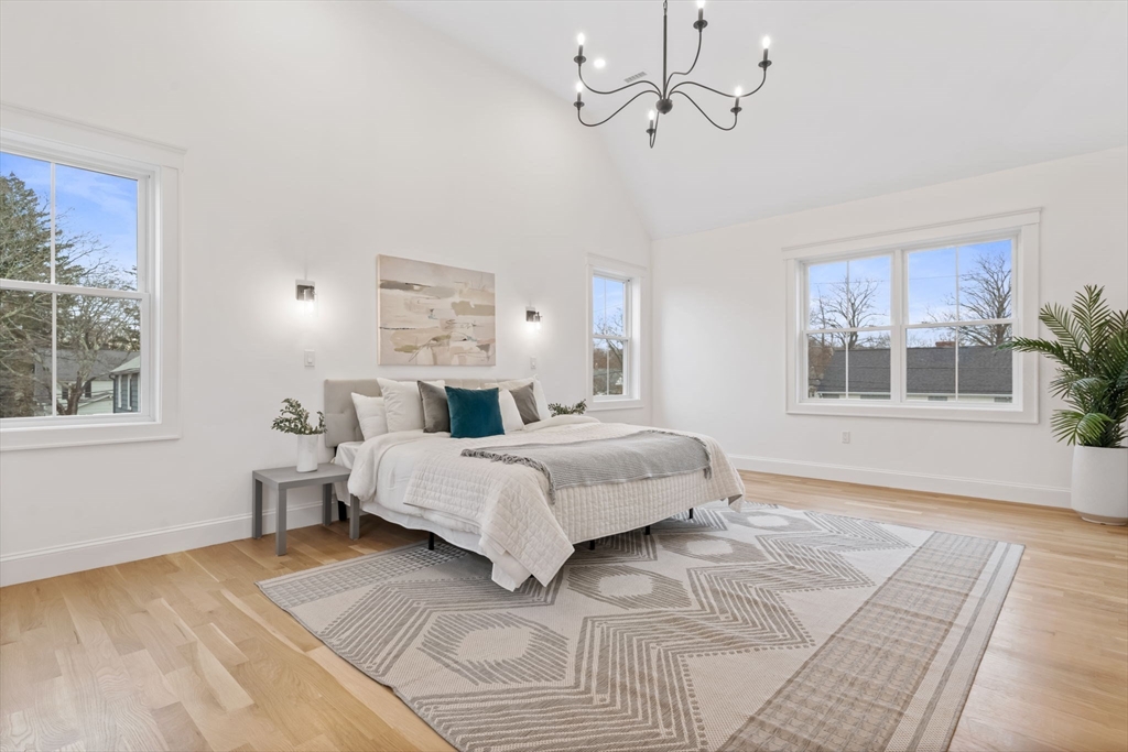 56 Valentine Road Arlington, MA 02476 - Photo 26 of 42 a bedroom with a large bed and a window