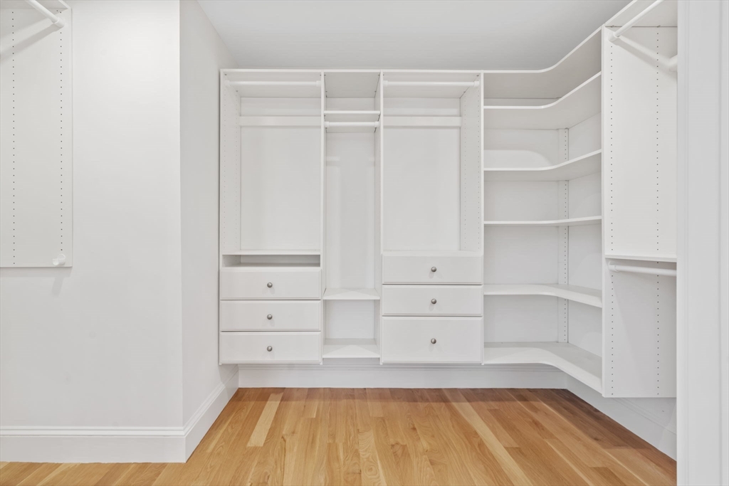 56 Valentine Road Arlington, MA 02476 - Photo 29 of 42 a view of a room with cabinets and wooden floor