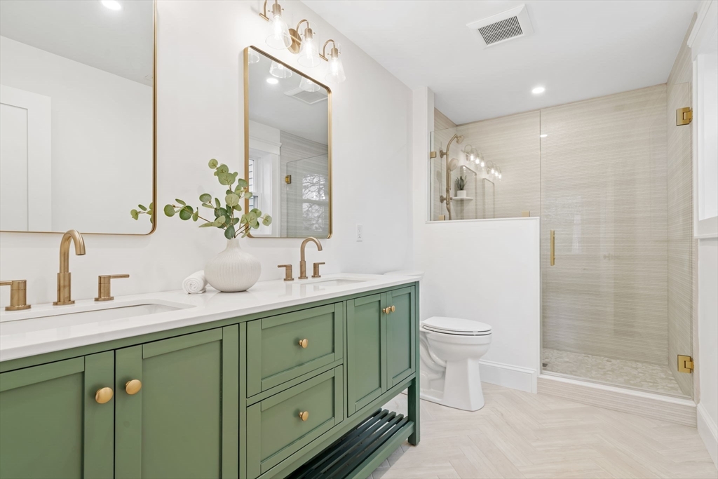 56 Valentine Road Arlington, MA 02476 - Photo 30 of 42 a bathroom with a double vanity sink toilet and shower