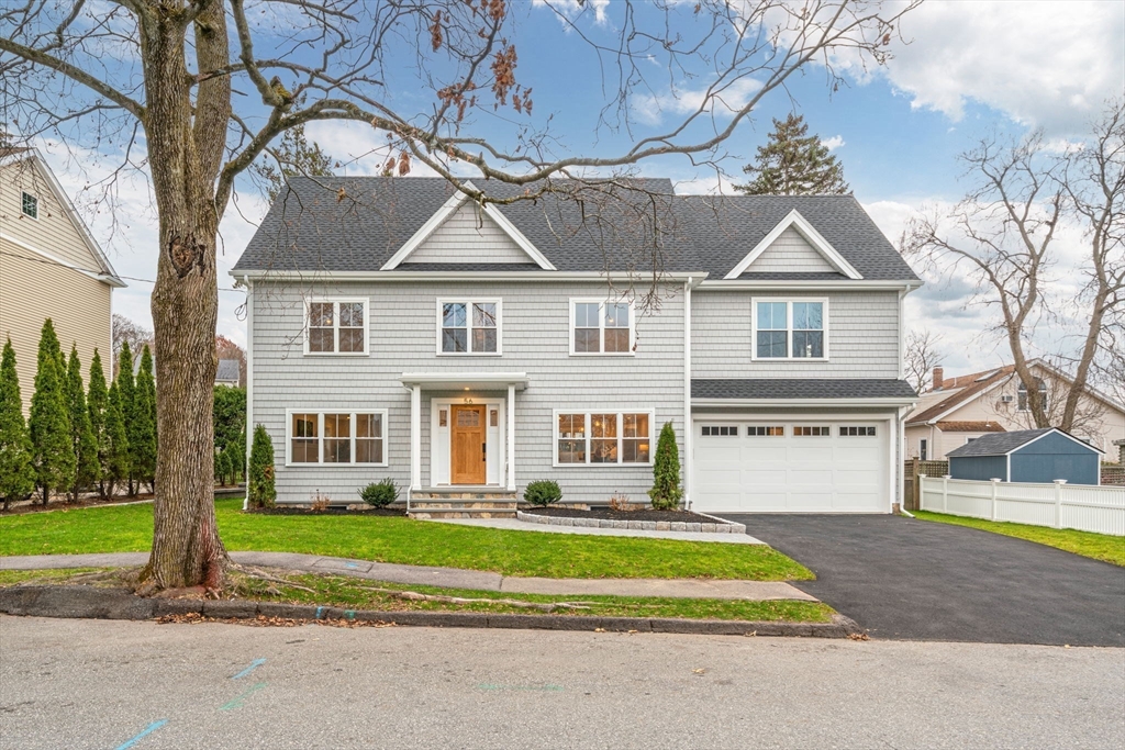 56 Valentine Road Arlington, MA 02476 - Photo 38 of 42 a front view of a house with a yard table and chairs