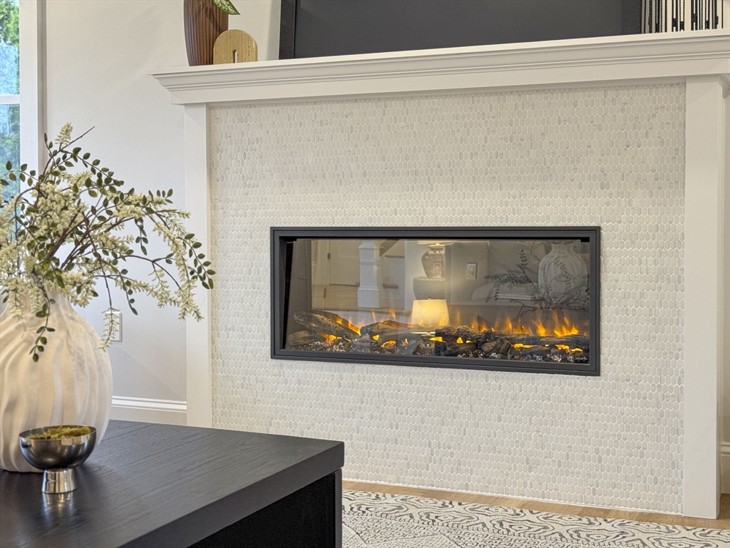 56 Valentine Road Arlington, MA 02476 - Photo 10 of 42 a room with a table and potted plant