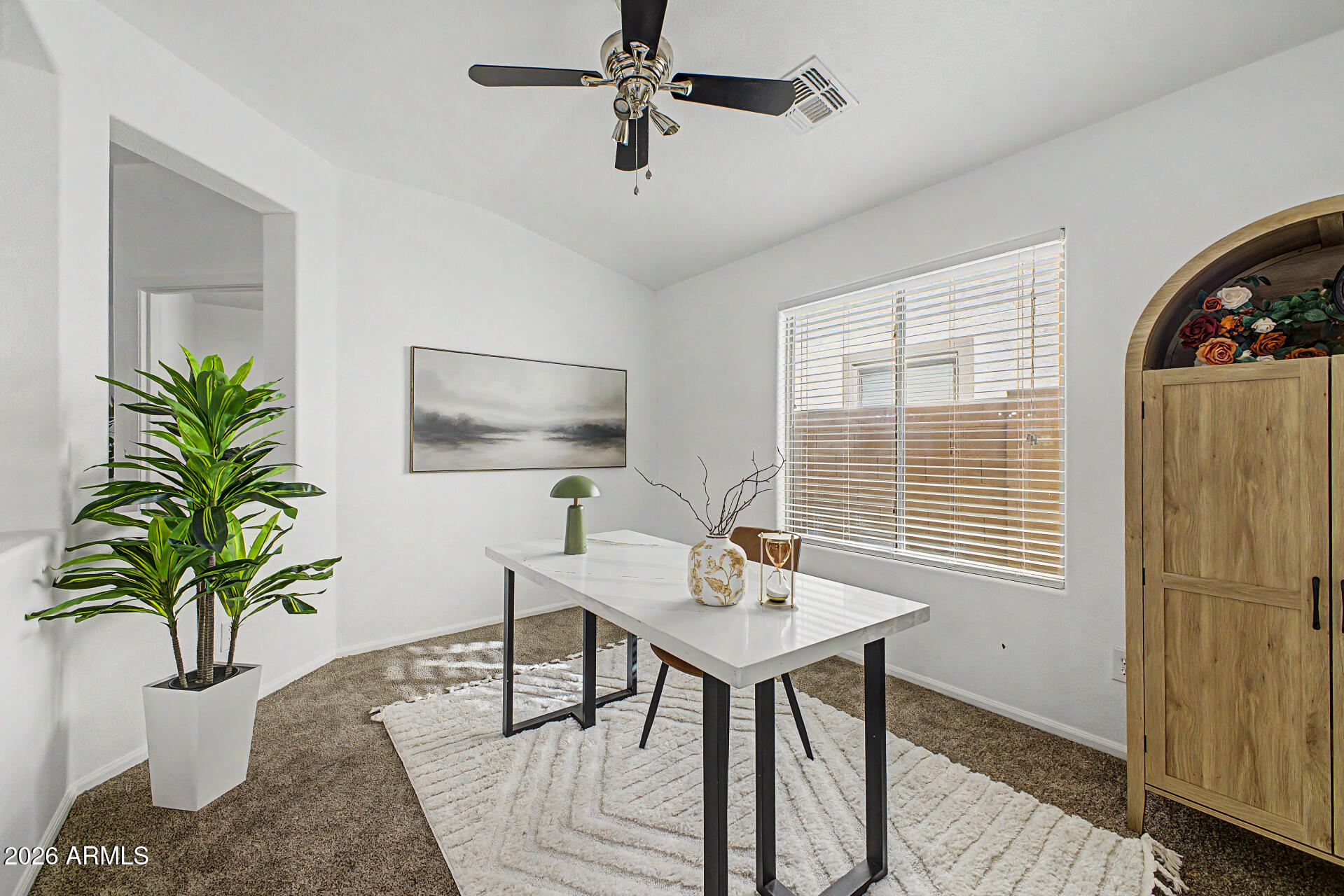 4168 East Sandy Way Gilbert, AZ 85297 - Photo 12 of 47 a workspace with furniture and a potted plant