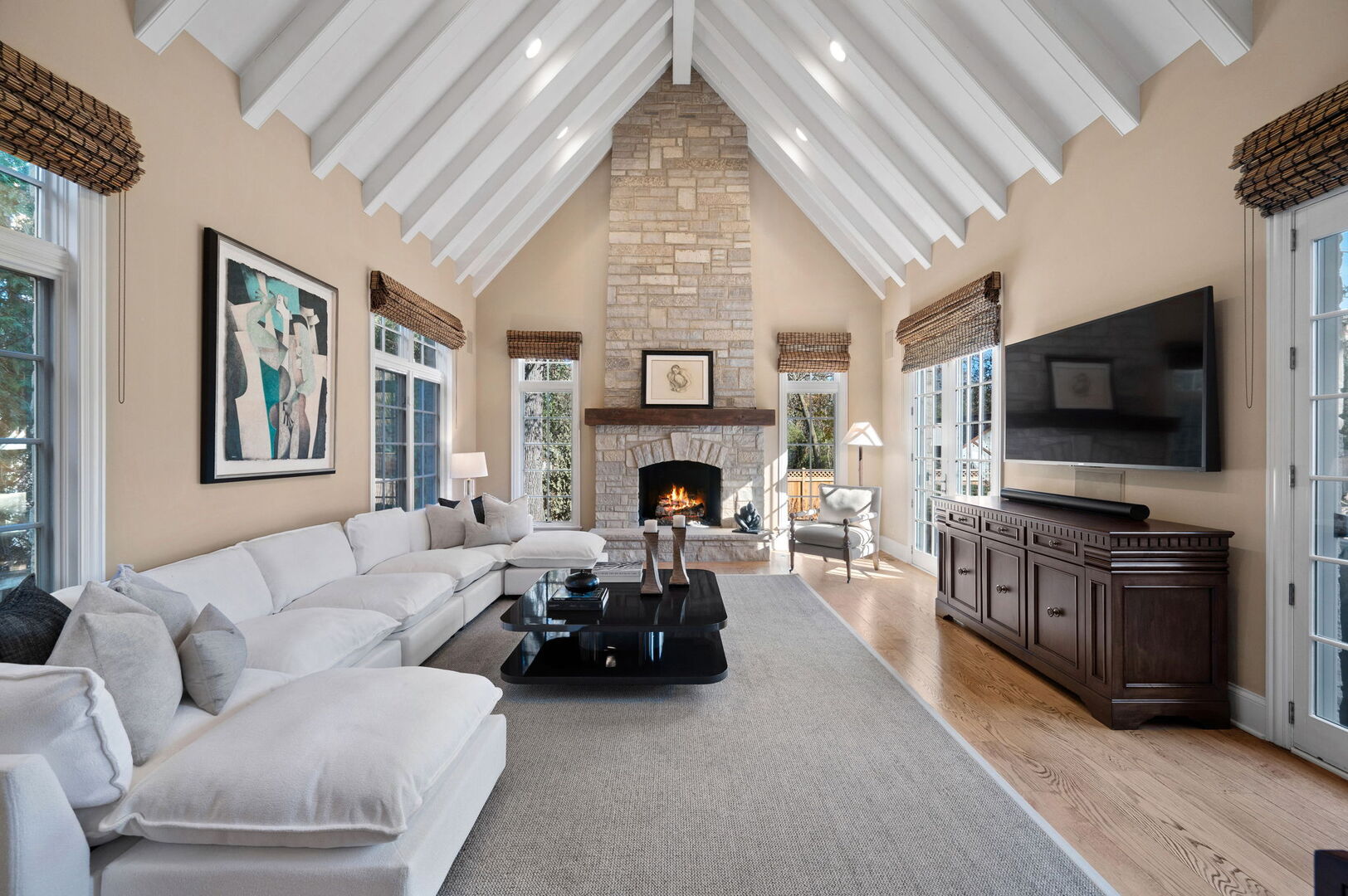 677 Greenleaf Avenue Glencoe, IL 60022 - Photo 18 of 54 a living room with furniture a flat screen tv and a fireplace