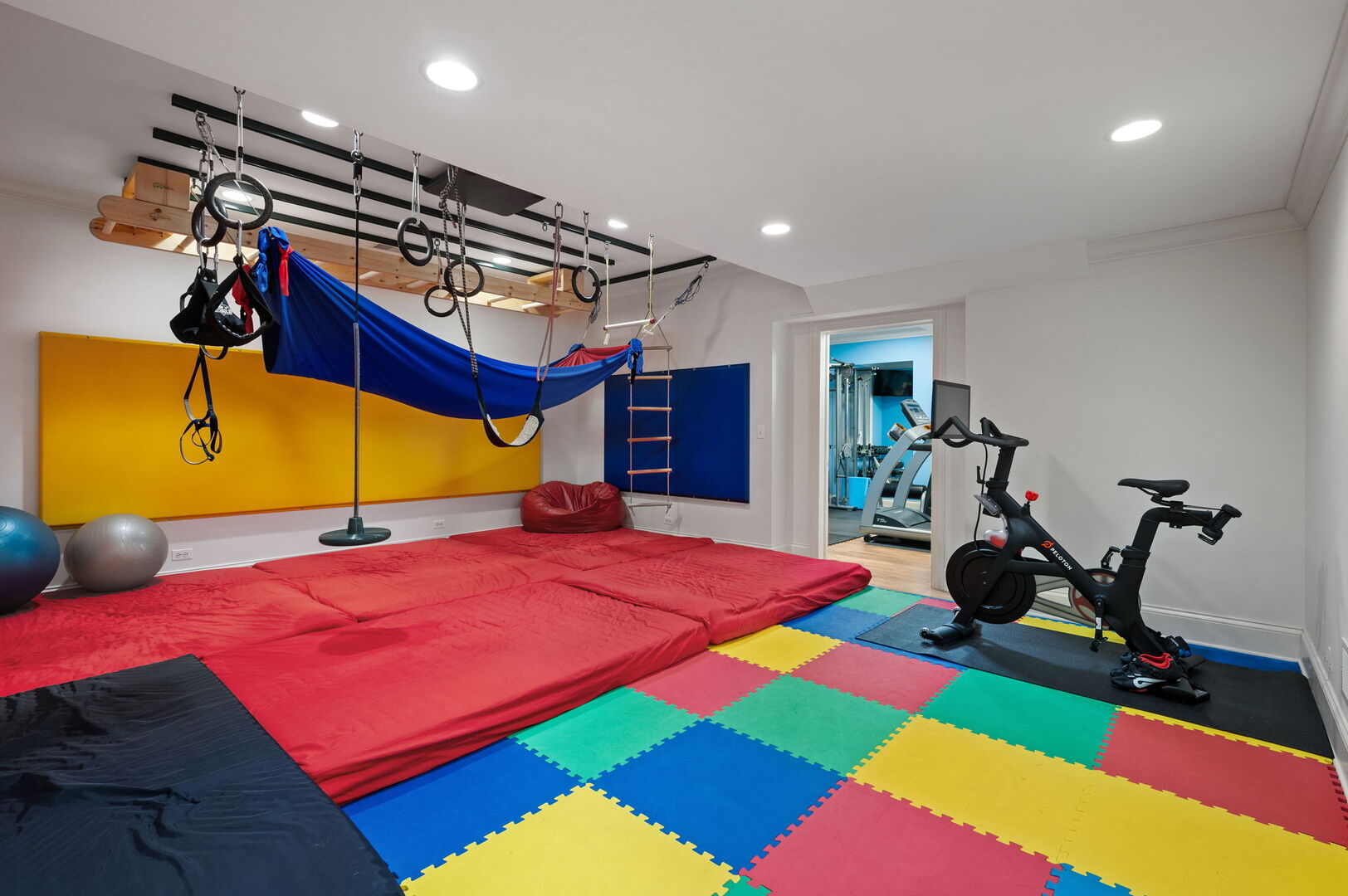 677 Greenleaf Avenue Glencoe, IL 60022 - Photo 40 of 54 a room with gym equipment and a table