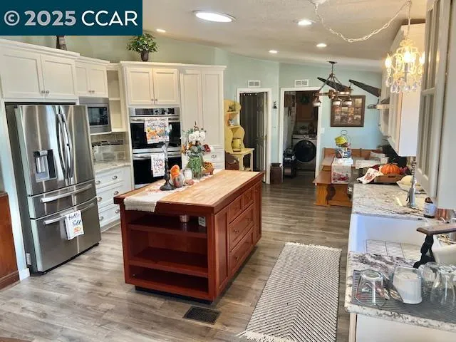 a view of a livingroom with furniture and a floor to ceiling window