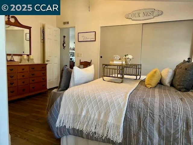 a living room with furniture and view of bathroom