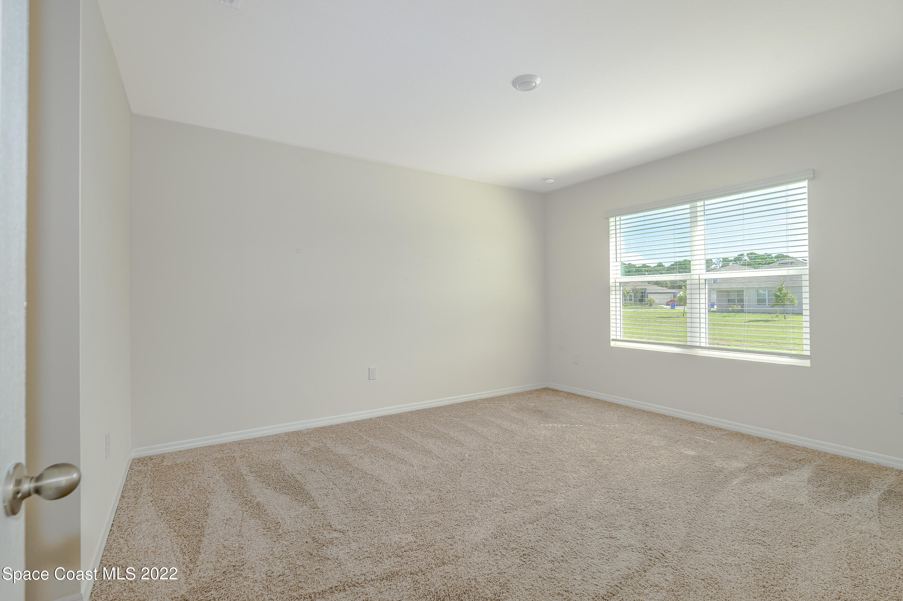 305 Sunset View Drive Edgewater, FL 32141 - Photo 17 of 37 an empty room with a window
