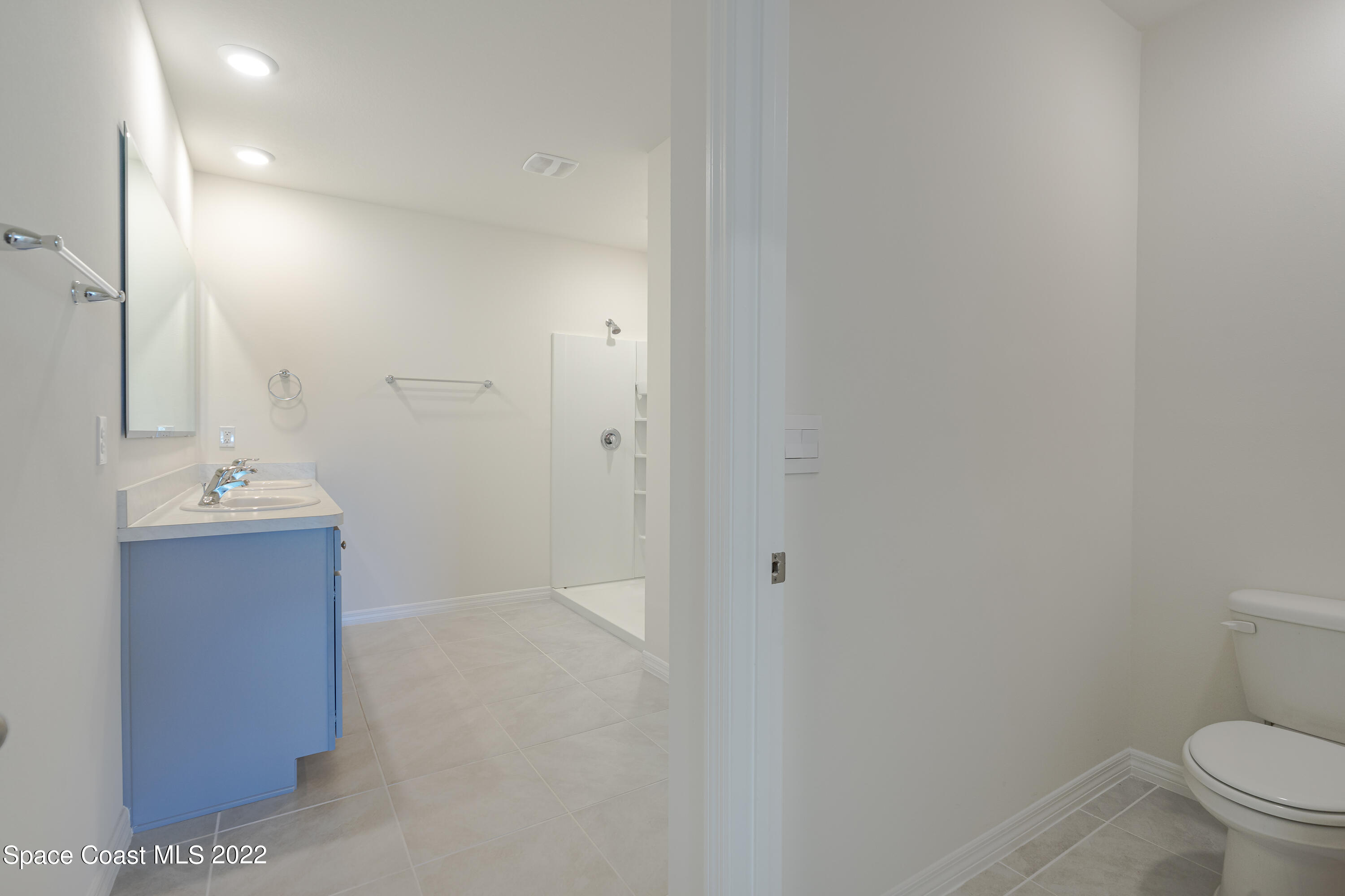 305 Sunset View Drive Edgewater, FL 32141 - Photo 20 of 37 a bathroom with a sink a toilet and shower