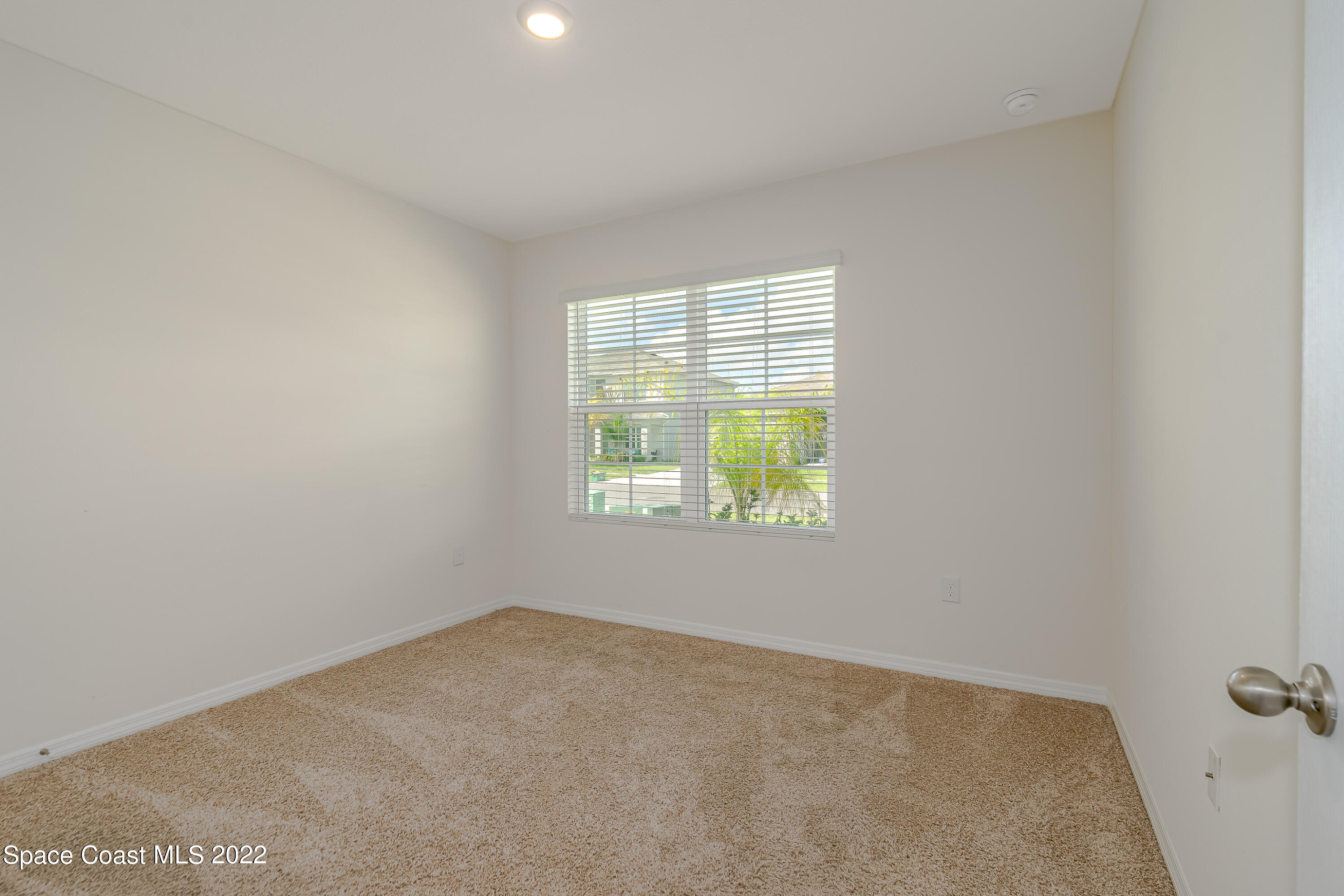 305 Sunset View Drive Edgewater, FL 32141 - Photo 23 of 37 an empty room with windows