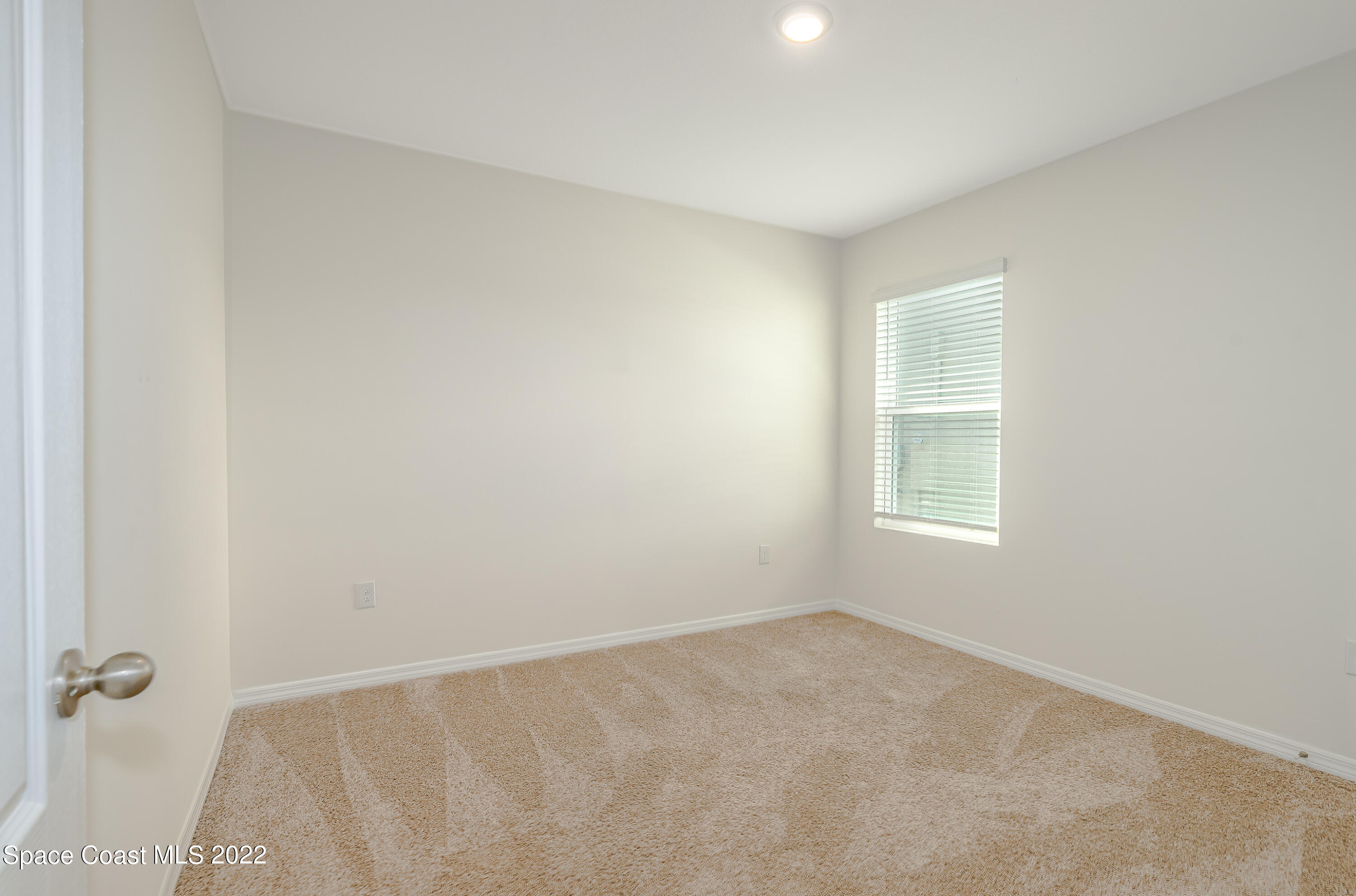 305 Sunset View Drive Edgewater, FL 32141 - Photo 25 of 37 an empty room with a window