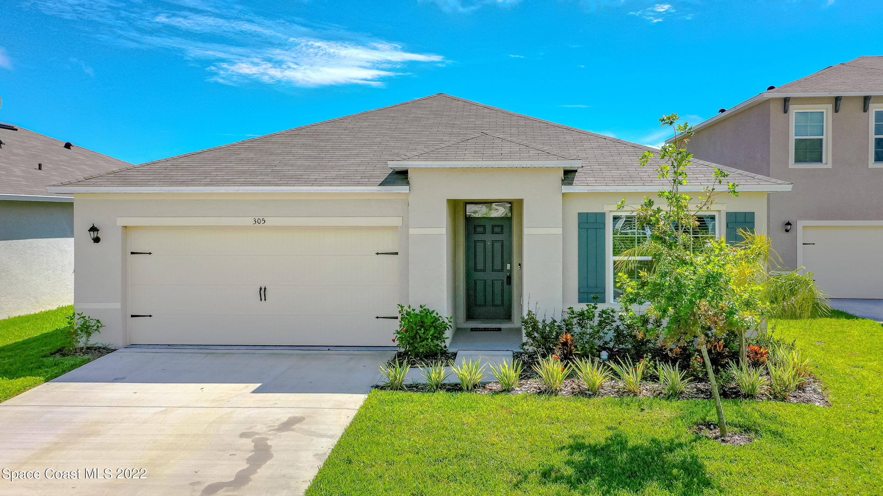 305 Sunset View Drive Edgewater, FL 32141 - Photo 30 of 37 a view of a house with garden