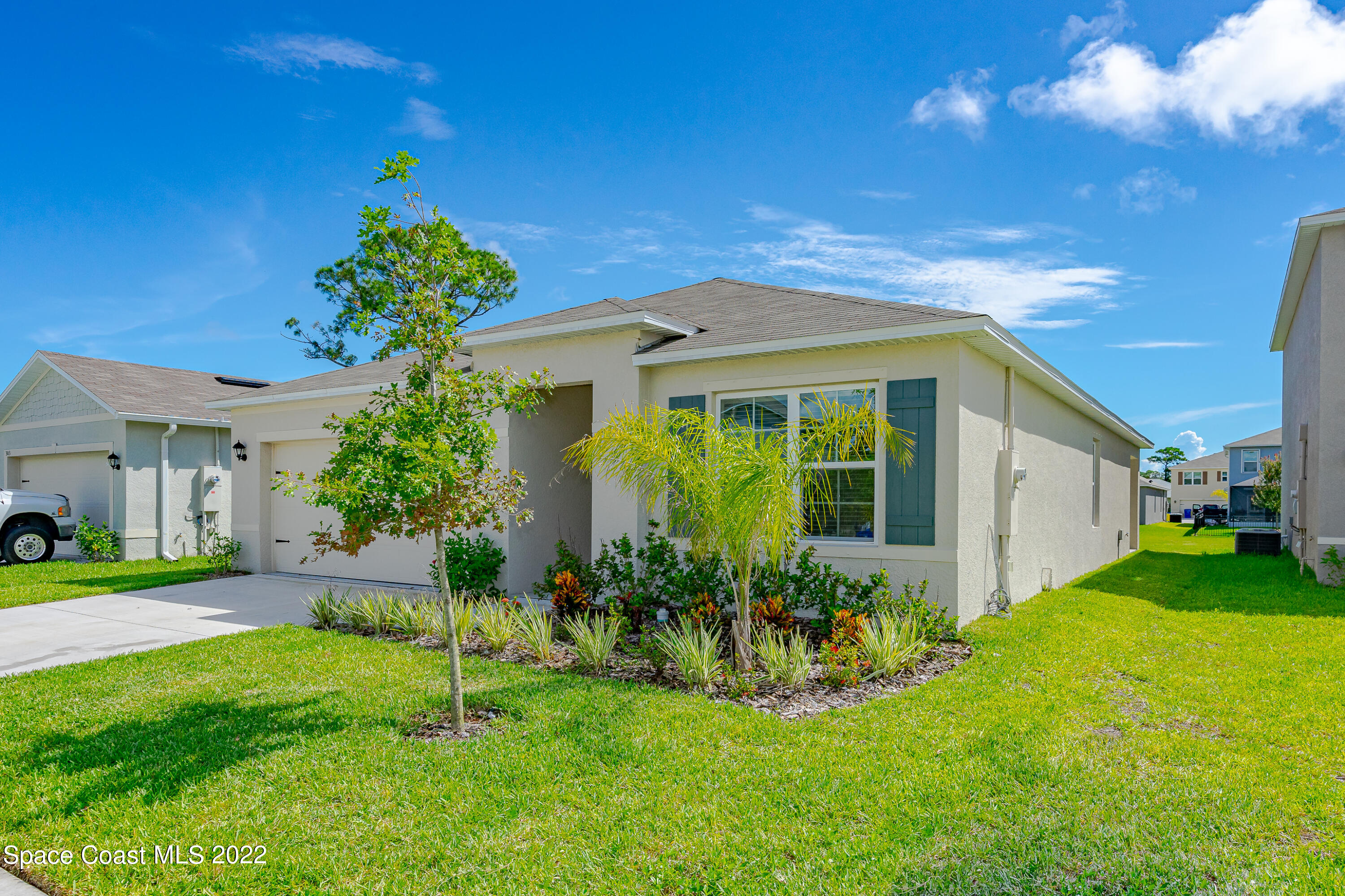 305 Sunset View Drive Edgewater, FL 32141 - Photo 3 of 37 a front view of a house with garden