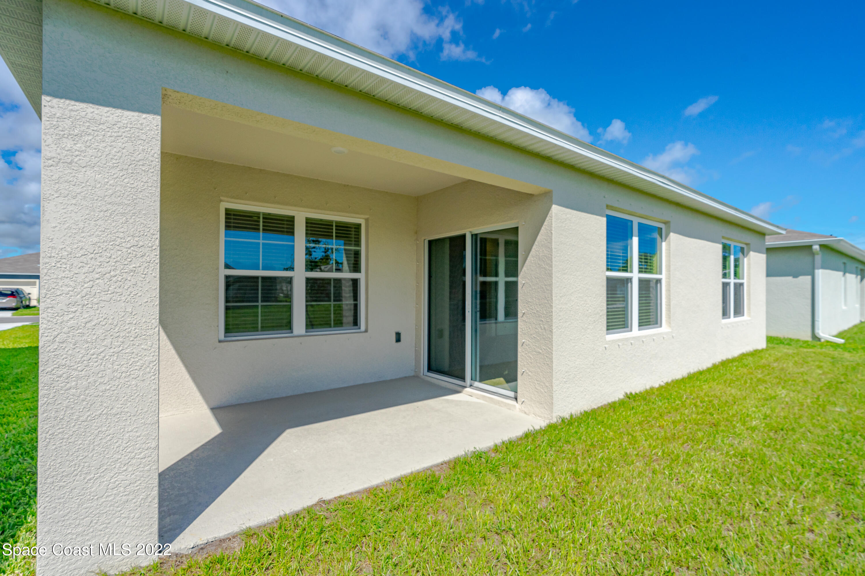 305 Sunset View Drive Edgewater, FL 32141 - Photo 5 of 37 a front view of a house with a garden