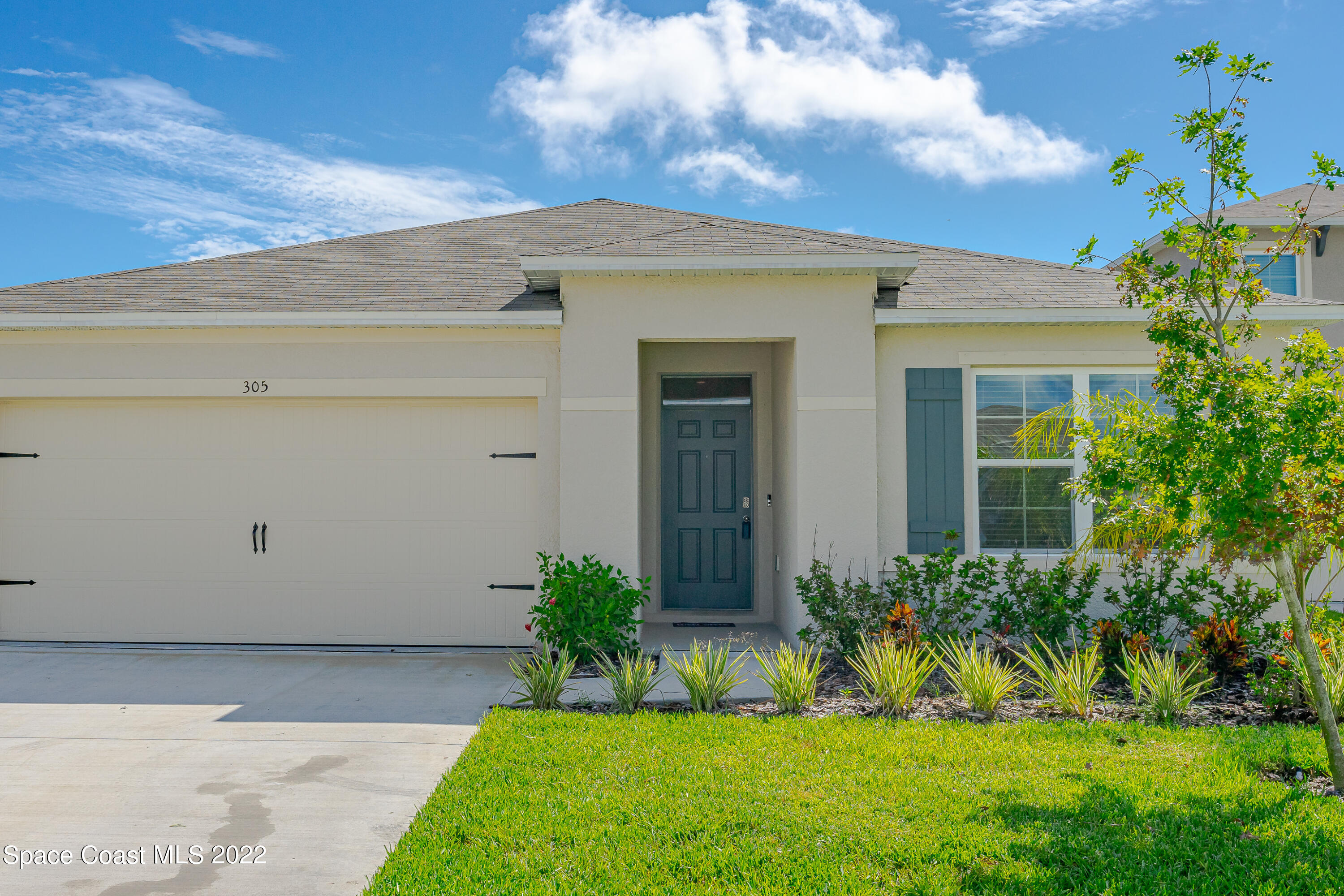 305 Sunset View Drive Edgewater, FL 32141 - Photo 8 of 37 a front view of a house with a yard