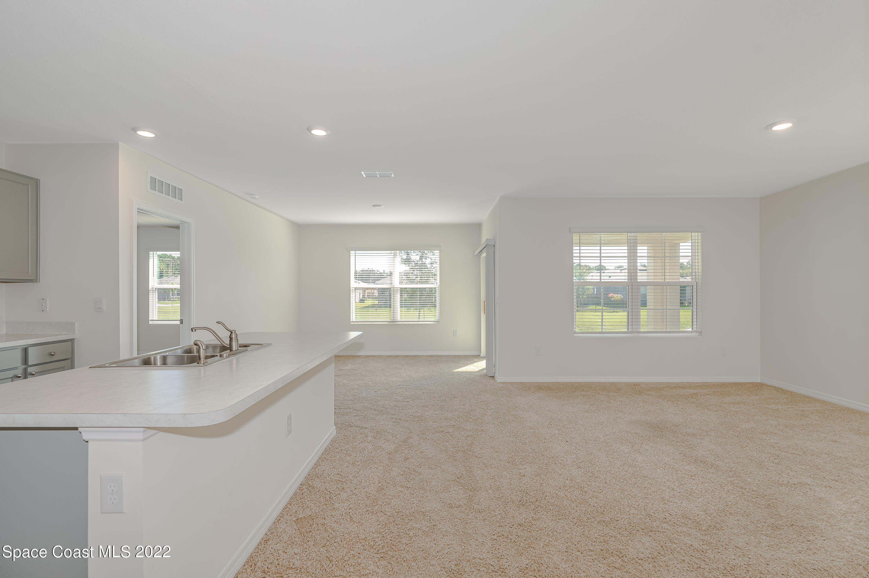 305 Sunset View Drive Edgewater, FL 32141 - Photo 10 of 37 a en suite bathroom with a sink mirror and window