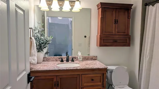 a room with a chair and wooden floor