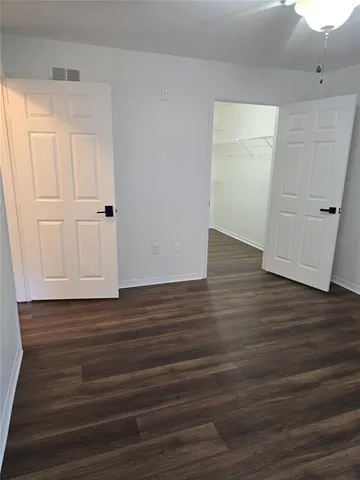 a view of a small space with wooden floor