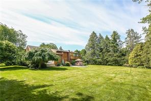 14 Whippoorwill Road Rye Brook, NY 10573 - Photo 1 of 1 a view of a yard with a house