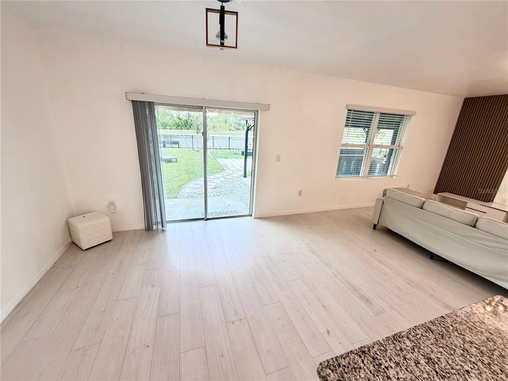 2731 House Finch Road Harmony, FL 34773 - Photo 14 of 57 a view of an empty room with a window