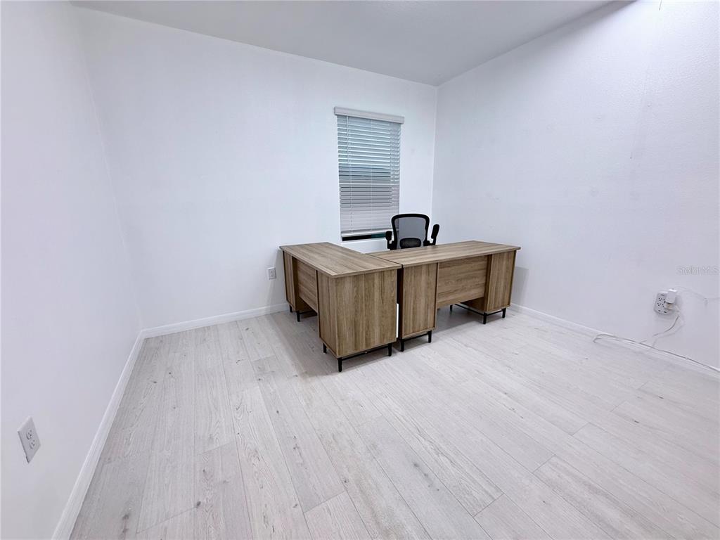 2731 House Finch Road Harmony, FL 34773 - Photo 20 of 57 a view of a room with wooden floor and sink