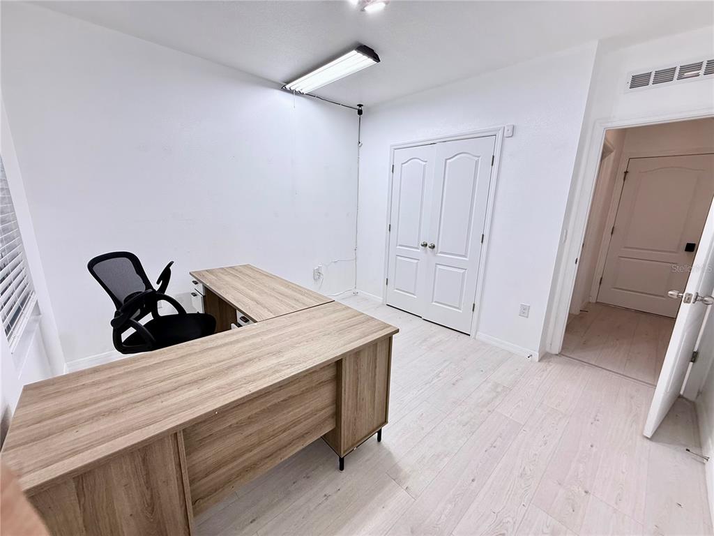 2731 House Finch Road Harmony, FL 34773 - Photo 21 of 57 a room with a sink and a refrigerator