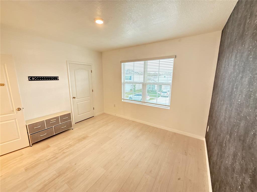 2731 House Finch Road Harmony, FL 34773 - Photo 45 of 57 an empty room with windows