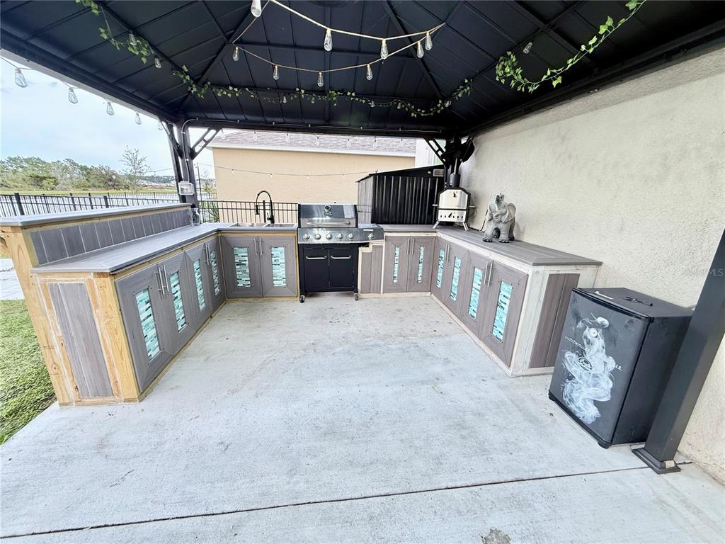 2731 House Finch Road Harmony, FL 34773 - Photo 56 of 57 a view of a porch with furniture