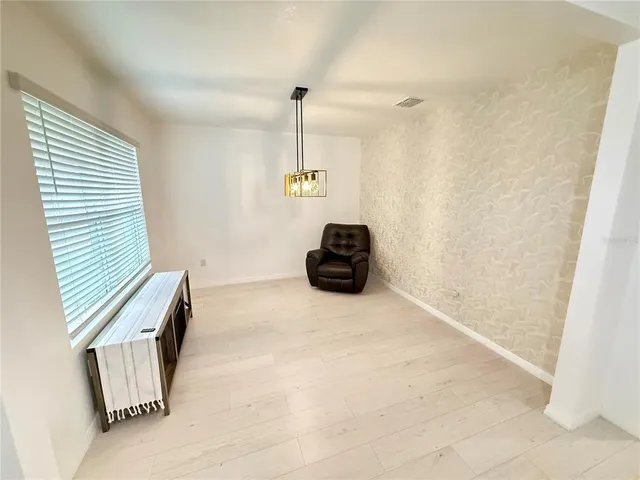 a view of empty room with windows