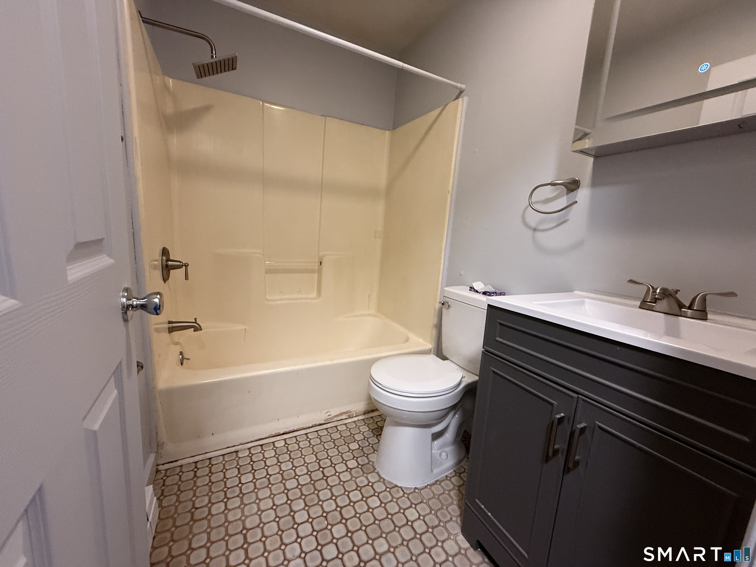 76 Summer Street, Unit 4 New London, CT 06320 - Photo 8 of 9 a bathroom with a sink a toilet and a bathtub