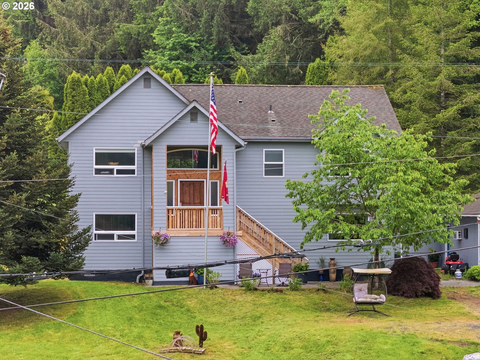 92085 Akerstedt Road Astoria, OR 97103 - Photo 1 of 48 a aerial view of a house with a yard table and chairs