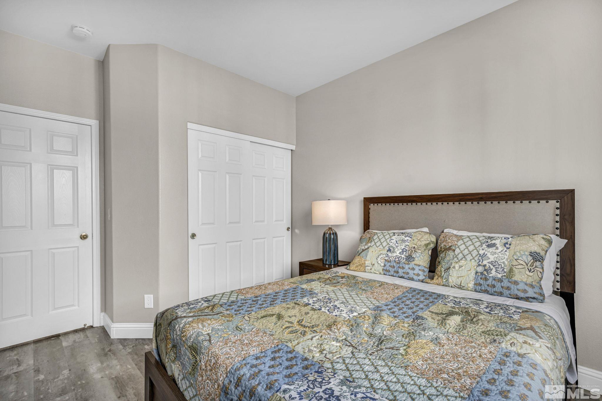 2296 Rio Lobo Lane Reno, NV 89521 - Photo 20 of 33 a bedroom with a bed and a night stand