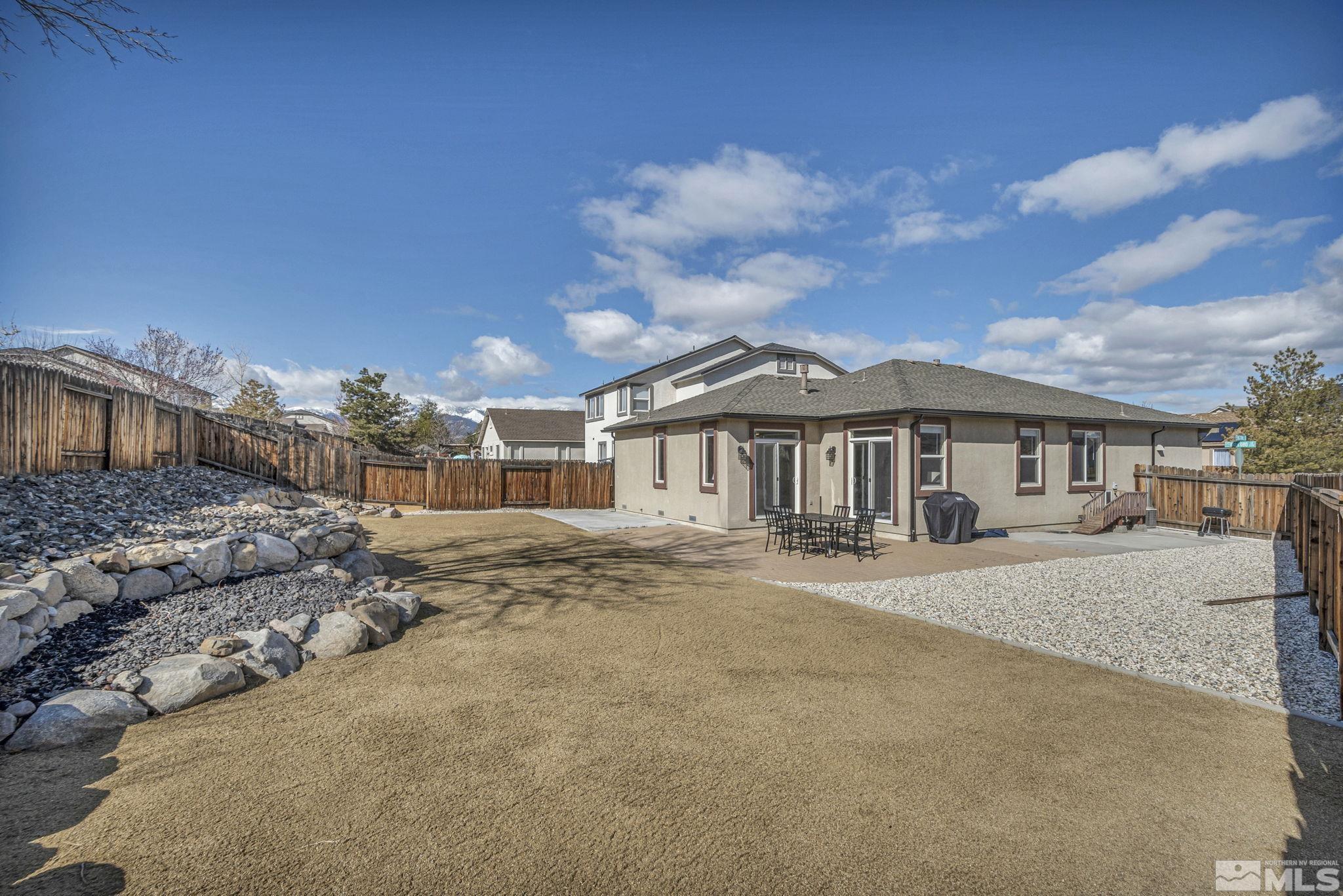 2296 Rio Lobo Lane Reno, NV 89521 - Photo 30 of 33 a front view of a house with a yard